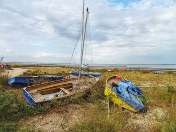 Grassy field against sky