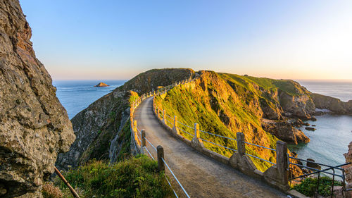 Scenic view of sea against clear sky during sunset