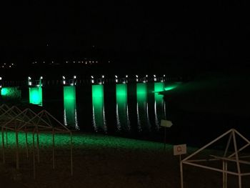 Illuminated water in row at night