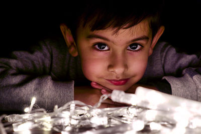 Close-up portrait of boy on table