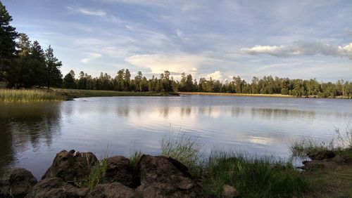 View of lake against cloudy sky