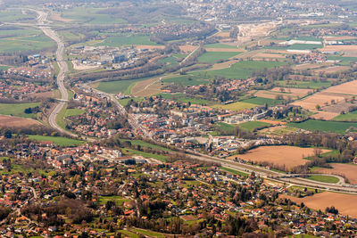 Aerial view of agricultural field by buildings