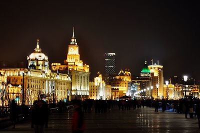 View of illuminated city at night during winter