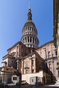 Low angle view of building against clear blue sky