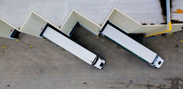 High angle view of empty chairs against building