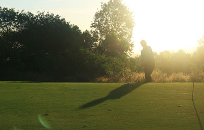 Shadow of person on field