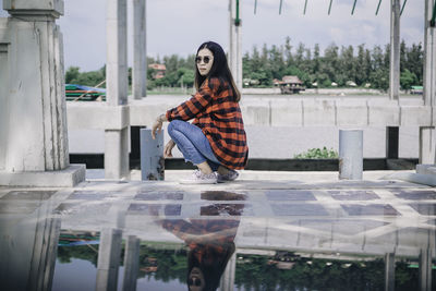 Portrait of woman sitting outdoors