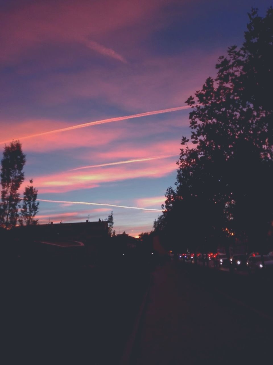 sunset, tree, sky, plant, silhouette, city, nature, illuminated, no people, cloud - sky, transportation, street, motor vehicle, road, car, dusk, beauty in nature, building exterior, architecture, outdoors, dark, purple