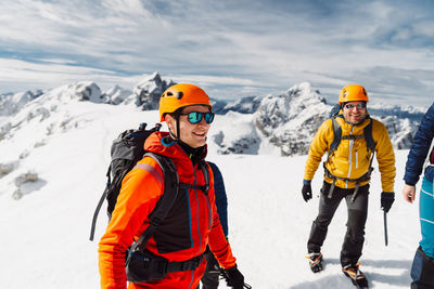 Rear view of man skiing on snow covered mountain