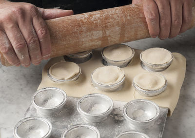 High angle view of person preparing food on table