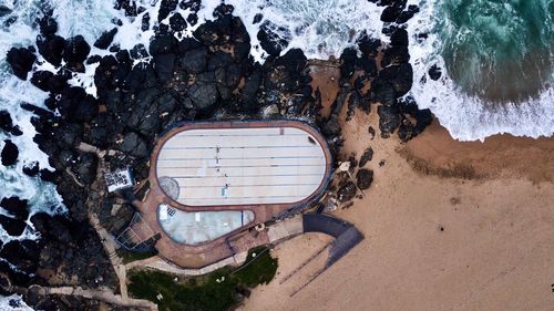 High angle view of abandoned building by sea