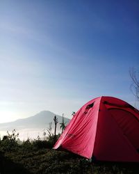 Tent on field against sky