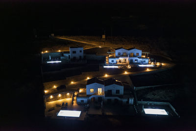 High angle view of illuminated buildings in city at night