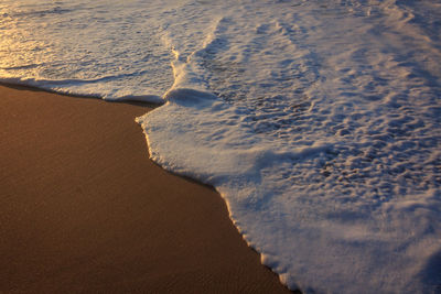 High angle view of sand at beach