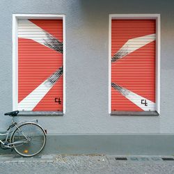 Bicycle leaning against stores