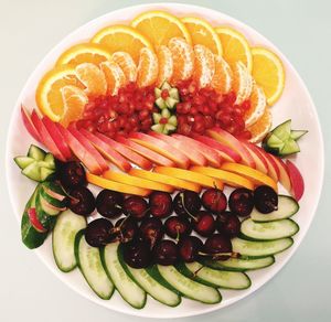 High angle view of fruits in plate on table