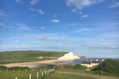 Scenic view of landscape against blue sky