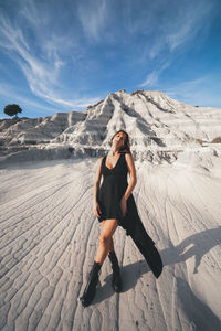 Full length of woman on arid landscape