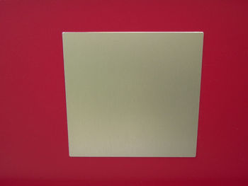 Close-up of paper against red background