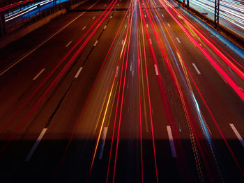 High angle view of light trails on road at night