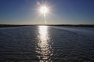 Scenic view of sea against clear sky during sunset