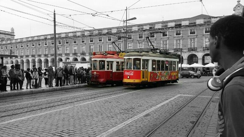 transportation, railroad track, public transportation, building exterior, architecture, mode of transport, rail transportation, built structure, railroad station platform, city, railroad station, train - vehicle, travel, men, city life, incidental people, person, passenger train