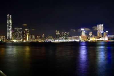 Illuminated city at waterfront