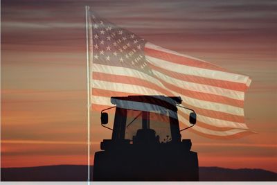 Red flag against orange sky