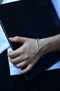 Close-up of man hand using mobile phone