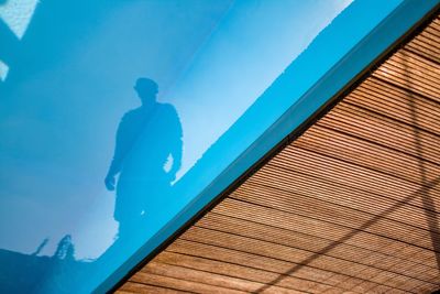 Man reflecting in swimming pool