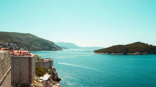 Scenic view of sea against clear blue sky