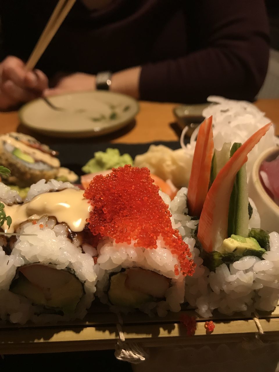 HIGH ANGLE VIEW OF SUSHI SERVED IN PLATE ON TABLE