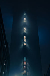 Low angle view of illuminated building in city at night