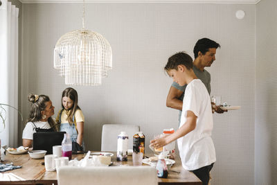 Family over dining table at home