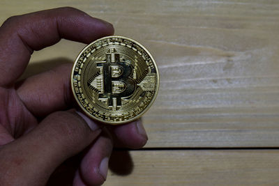 Close-up of human hand holding metal