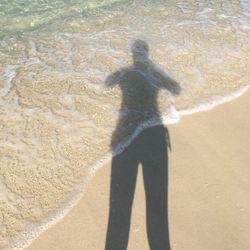 Shadow of man on beach