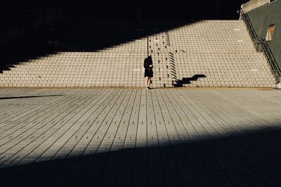 Shadow of man on woman on road