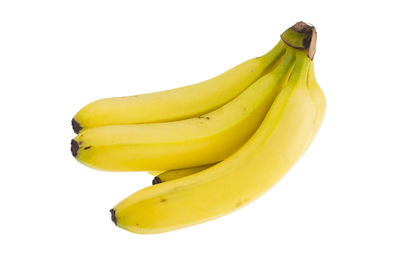 Close-up of yellow fruit against white background