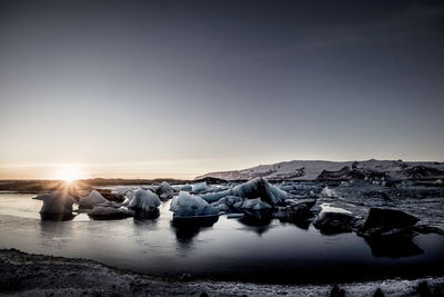 Scenic view of sea against clear sky during sunset