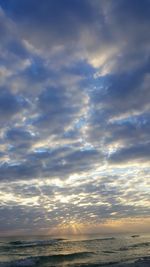 Scenic view of sea against sky at sunset