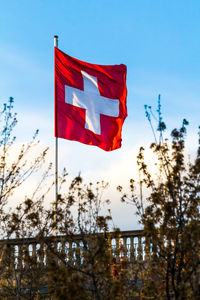 Low angle view of flag on pole against sky