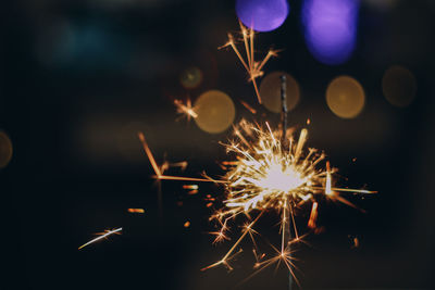 Close-up of sparkler at night