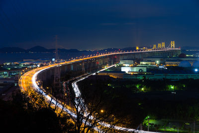 High angle view of illuminated buildings in city at night