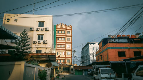 Buildings in city against sky