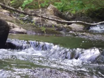 Close-up of water flowing in river