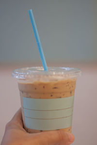 Close-up of hand holding drink