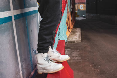 Low section of person standing on street