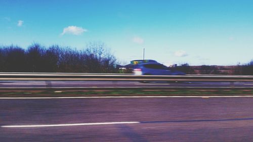 Blurred motion of train on road