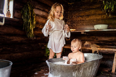 Children play in the old bathhouse