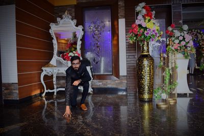 Full length of boy standing against graffiti